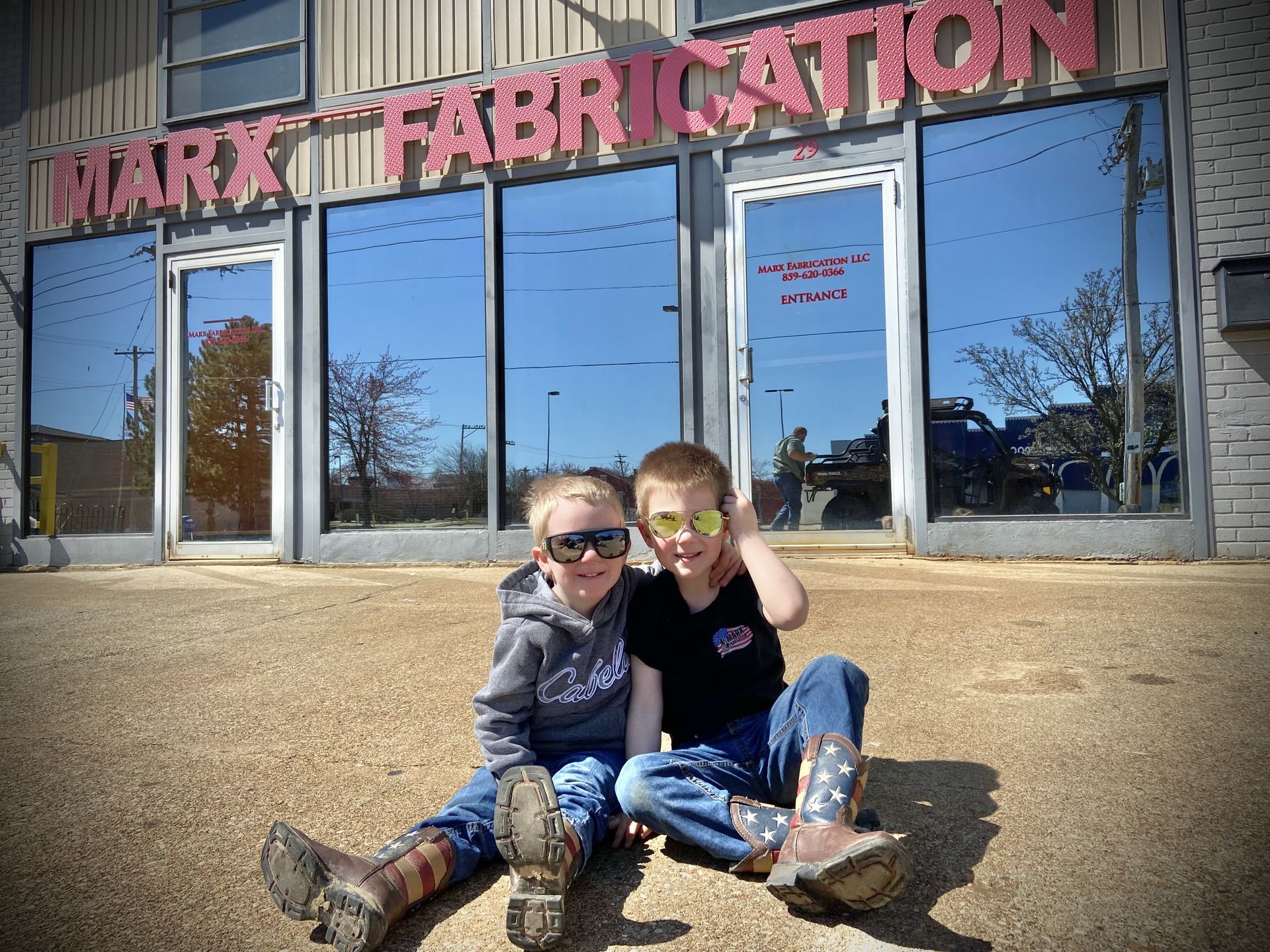 Founder Brent Marx&rsquo;s sons Ben and Jack in front of the Marx Fabrication shop