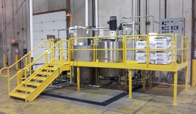 Custom fabricated steel work platform with stairs and railings